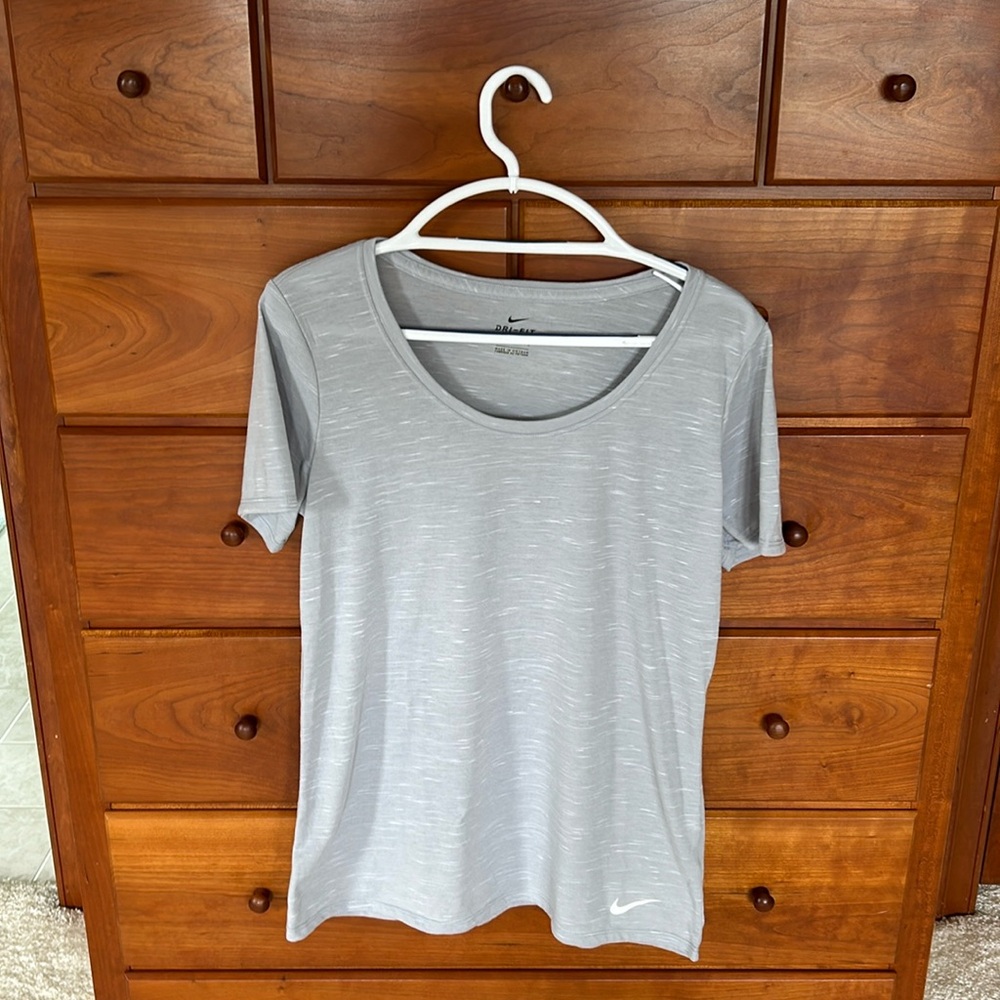 Gray Nike neck tee, women’s large.